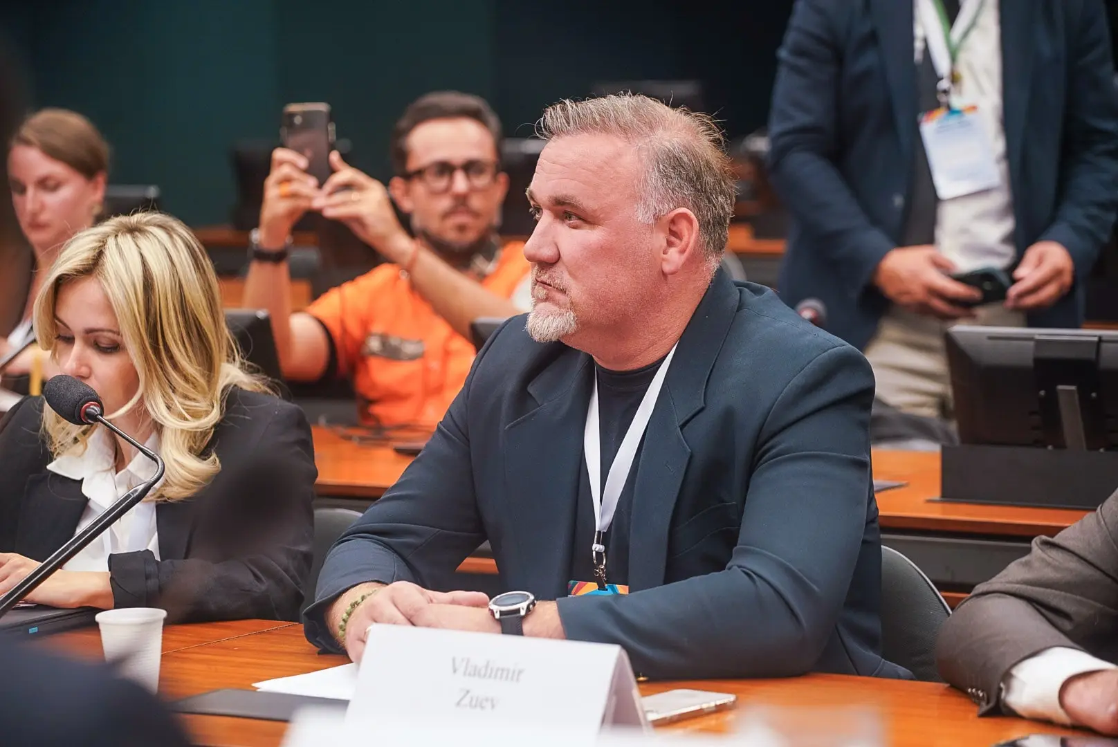 Portrait of a business leader speaking into a microphone